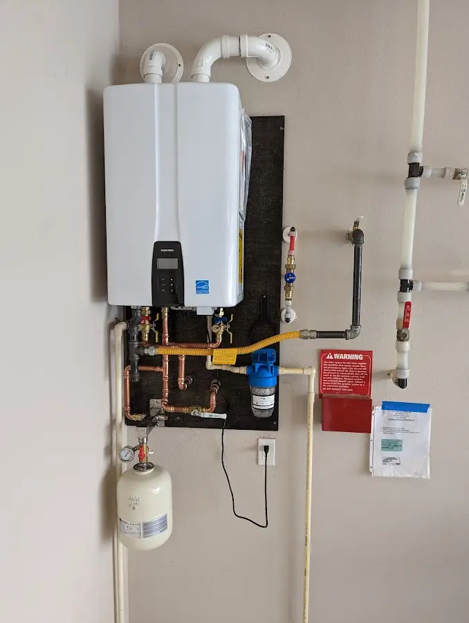 Professional plumber installing copper piping in a Edmond home